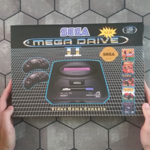 Сучасна 16 бітна ігрова консоль Sega Mega Drive 2 з вбудованими іграми і підтримкоб картриджів. Розпаковка і огляд.
